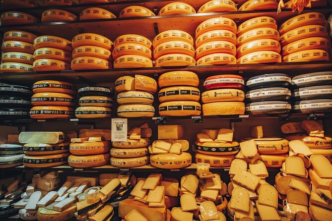 Wheels of Dutch cheese stacked on the shelves of an Amsterdam cheese shop
