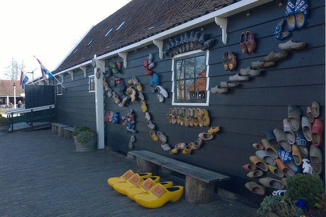 Painted wooden clogs hung across the wall of the workshop at Zaanse Schans